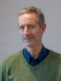 Poträttbild av John Lapidus